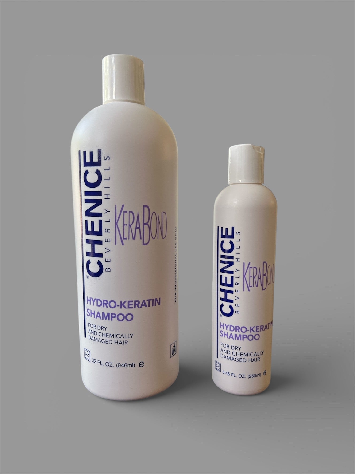Two bottles of Chenice Beverly Hills Kerabond Hydro-Keratin Shampoo on a gray background